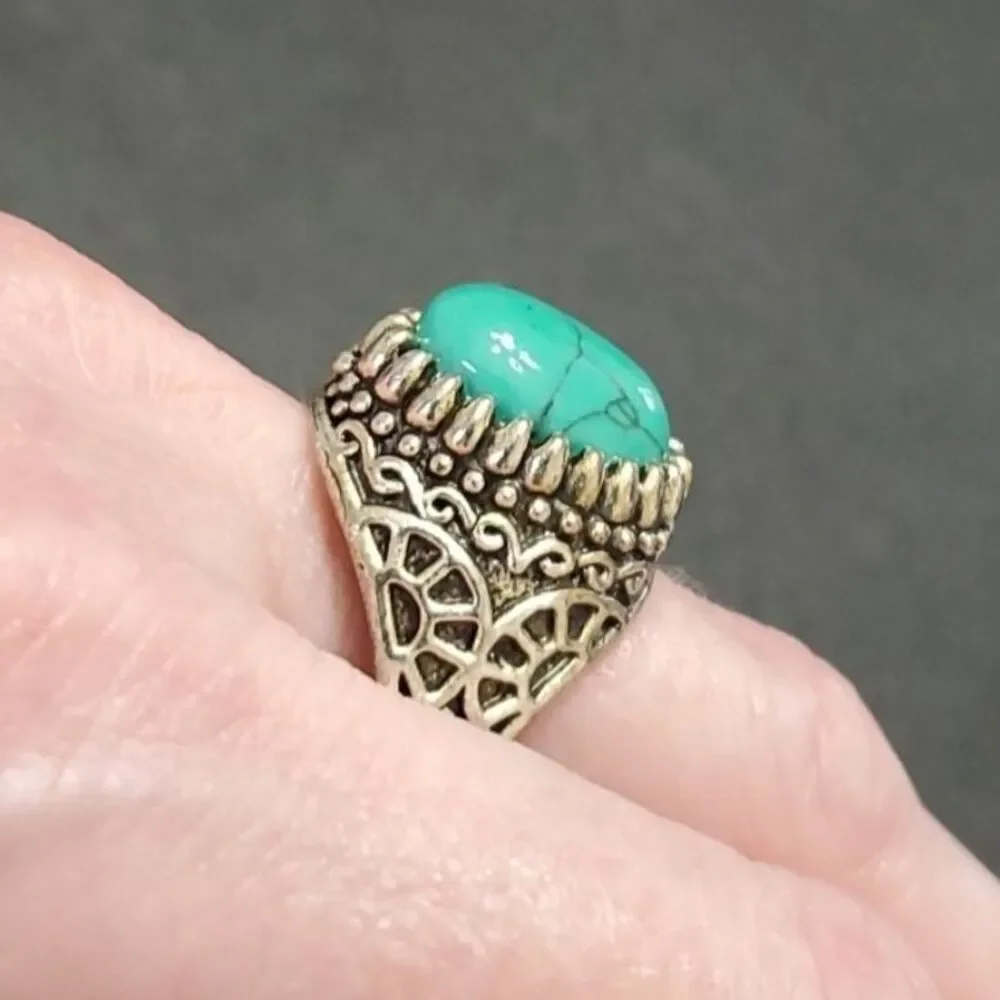 Silver tone ring with blue stone approx 11